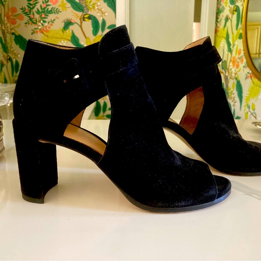 Black suede peep toe booties.